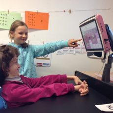 Isabel uses the Tobii eye tracking communicator