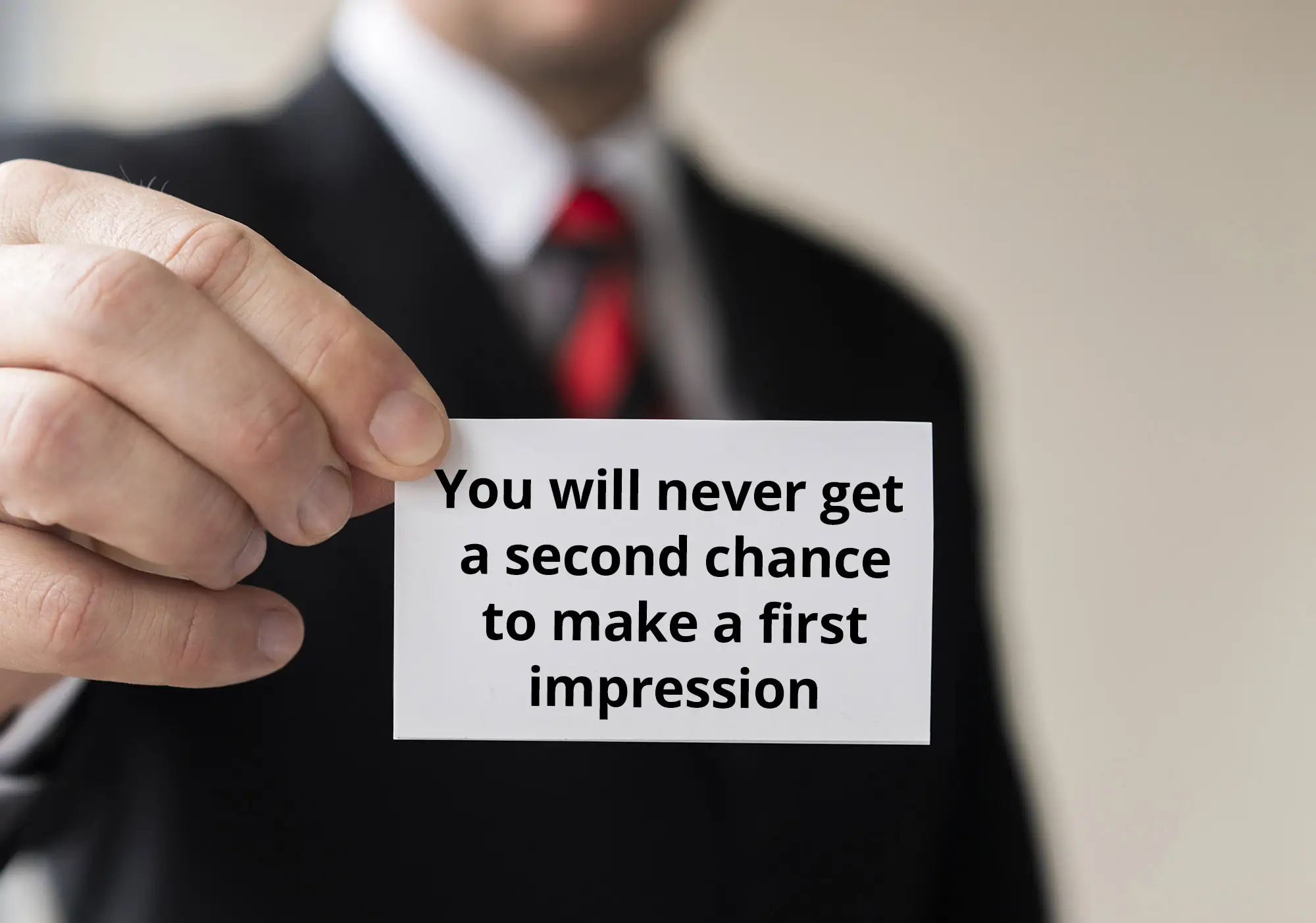 man holding businesscard first impression