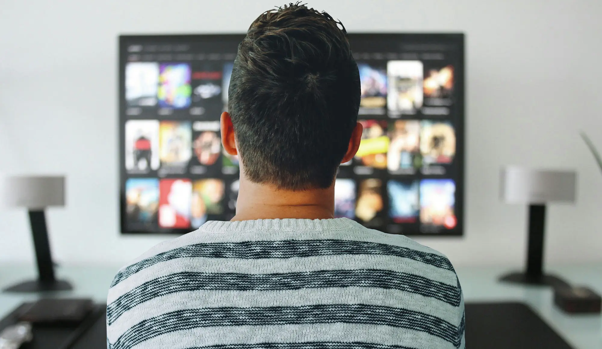 man watching a spot on tv